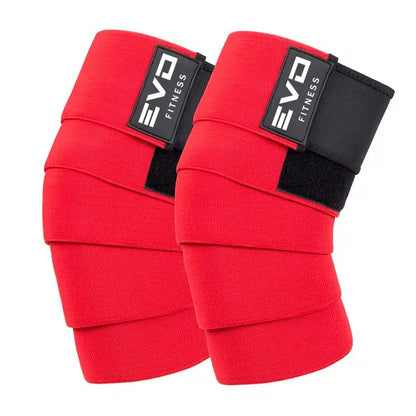 Red padded training knee sleeves with black adjustable straps and EVO logo tags.