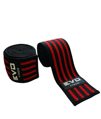 Black and red elastic training knee wraps with EVO logo and three red stripes.